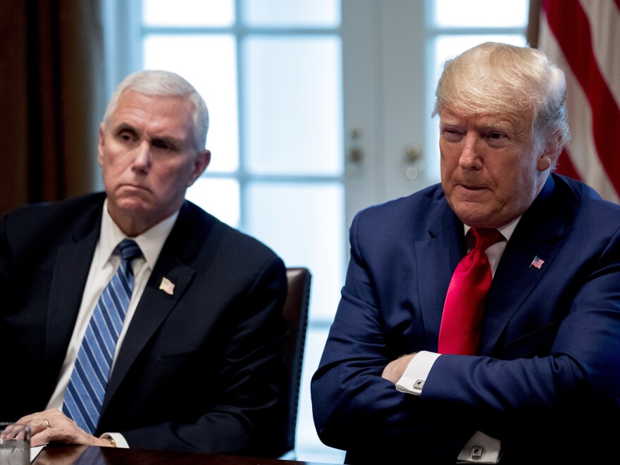 President Donald Trump and Vice President Mike Pence, left, attend a meeting with pharmaceutical executives on the coronavirus in the Cabinet Room of the White House on Monday.