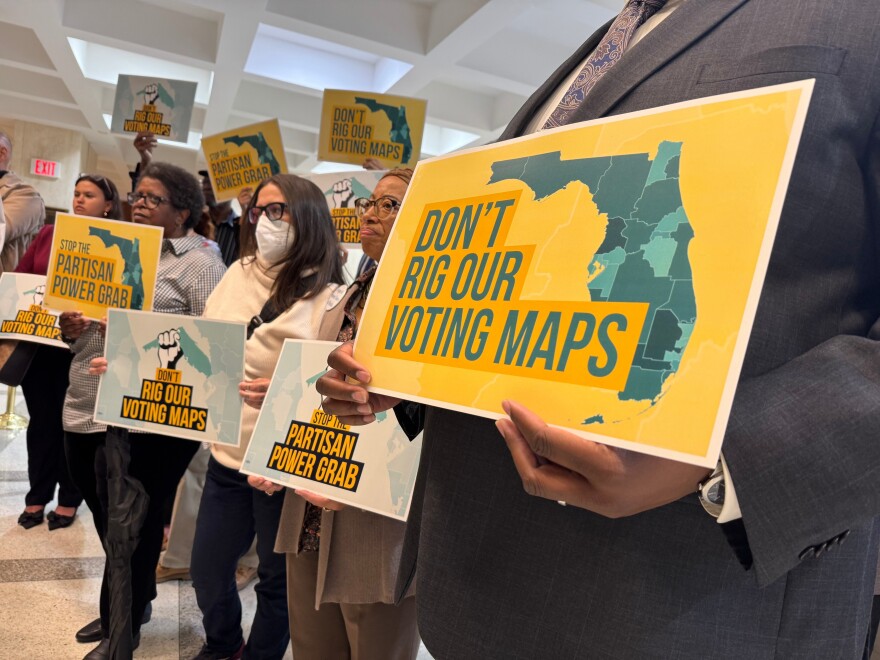 Opponents of mid-decade efforts to redraw congressional voting districts gather to protest in the Florida Capitol in Tallahassee, Fla., Dec. 2, 2025. 