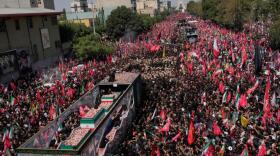 The truck carrying the coffins of the slain Iranian Supreme Leader Ayatollah Ali Khamenei and members of his family makes its way through mourners during the funeral procession toward Azadi Tower in Tehran, Iran, Monday, July 6, 2026. (Vahid Salemi/AP)