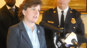mayor miner speaking at a podium