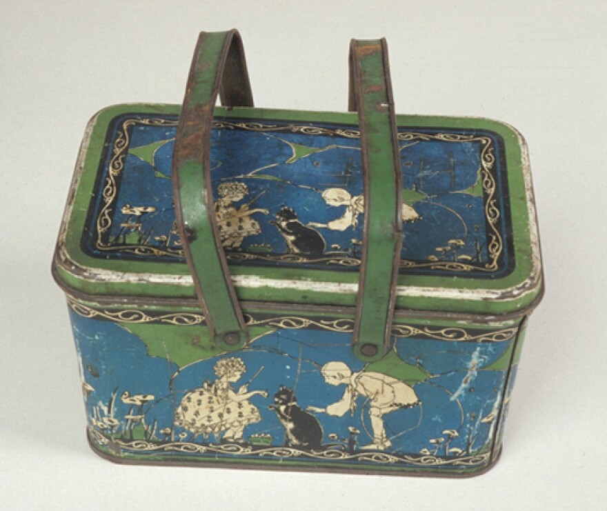 This tin-plated steel lunch box was manufactured by the Ohio Art Company in the 1920s.