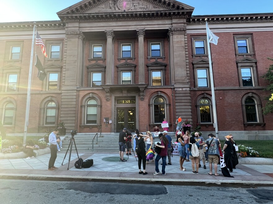 Activists gather outside New Bedford City Hall Tuesday before a meeting of the City Council to discuss the use of Flock cameras in the city.