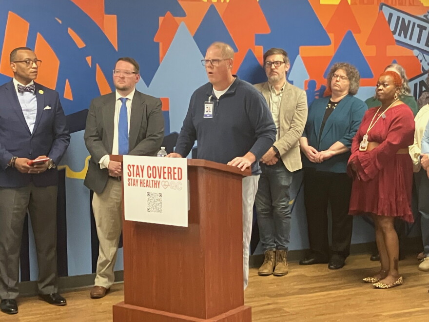 Community Health Care CEO Tom Bowman speaks at Friday's launch of Stay Covered Stay Healthy QC, surrounded by other coalition members, at United Way QC in Bettendorf, Oct. 9, 2026.