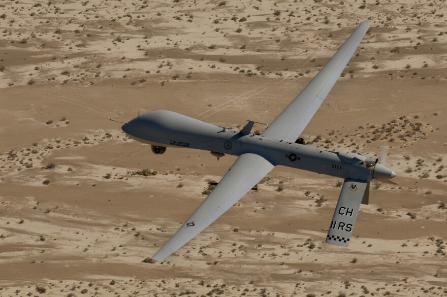 In this Sept. 6, 2007 photo, an MQ-1 Predator unmanned aerial vehicle flies over a range in Nevada.