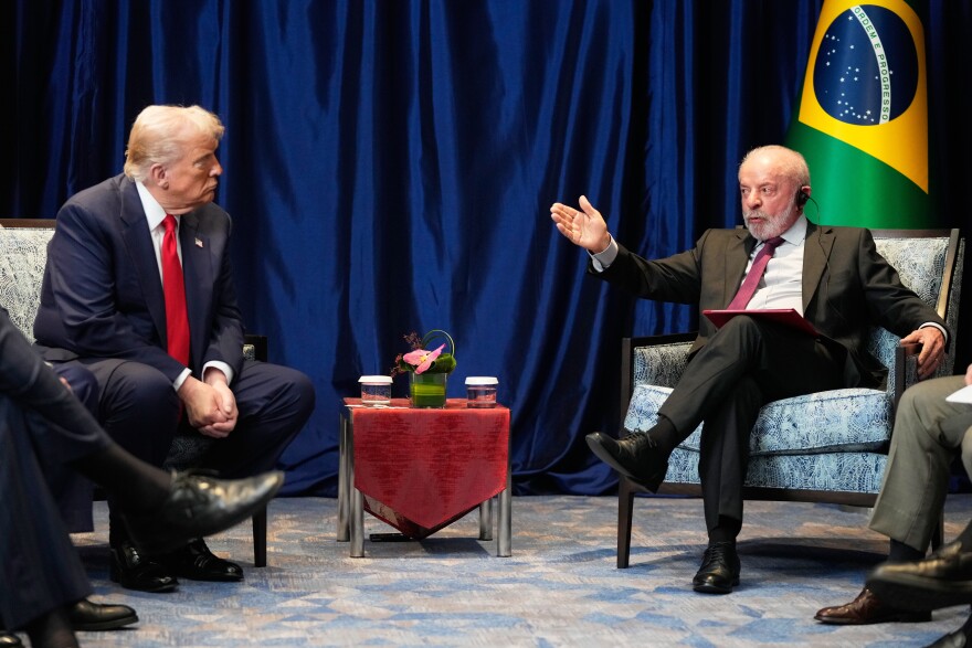 Two major world leaders sit in chars across from each other