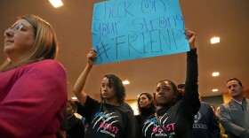 Diana Bruce, left, and Kelsie Rhimes, right, hold a sign during Lincoln University Founders’ Day Convocation on Thursday, Feb. 8, 2024, at Lincoln University in Jefferson City, Mo. Students started the protest outside before moving entering the Robert & Charlene Mitchell Auditorium.