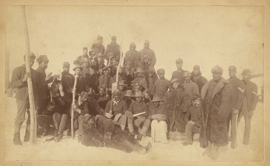 Soldiers of the 25th Infantry — some wearing buffalo robes — pose for a photo in Montana in the late 19th Century. Like the men of the 9th and 10th cavalry, these troops were referred to as Buffalo Soldiers.