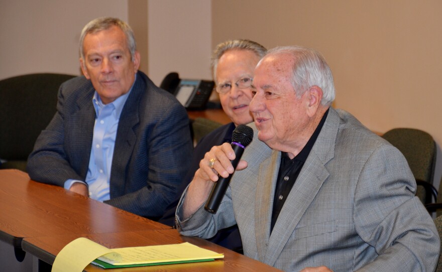 Hopkins County Memorial Hospital Board members look on while Board President Tim Kelty tells the history of the hospital.