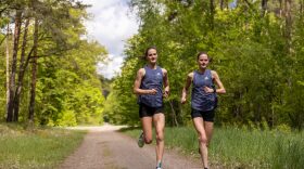 BERLIN, GERMANY - MAY 19: Twins Debbie (L) and Rabea Schoeneborn during a training session in Grunewald, the largest forested area in the western part of Berlin on May 19, 2021 in Berlin, Germany. With only three German tickets for the women's marathon in Tokyo twin sisters, Debbie and Rabea became competitors in pursuit of their Olympic dream. Competitors - but also sisters, training partners, flatmates. They share the same coach and the same club and both ran below the Olympic standard of 2:29:30. However, only Debbie has a safe ticket. Her time is 8 second faster than her sisters - a blink of an eye in a race 42,195 km long but the difference between a ticket to Tokyo or no ticket at all. Her twin Rabea who is now in the alternate position, will probably focus on the Berlin Marathon in autumn instead.  (Photo by Maja Hitij/Getty Images)