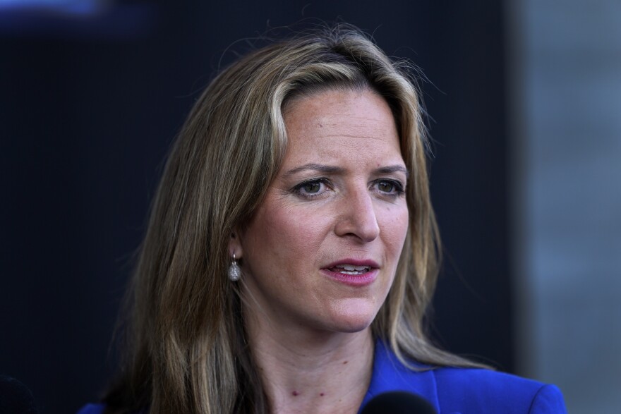 Three-quarter-view head-and-shoulders candid portrait of Benson, who's wearing a blue jacket