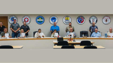 Tribal leaders and representatives from the Intertribal Wildlife Council(Seated, left to right): Chief Robert Burkybile (Modoc Nation), Chief Rosanna Dobbs (Peoria Tribe of Indians of Oklahoma), Second Chief Roy Baldridge (Shawnee Tribe), Chief Glenna Wallace (Eastern Shawnee Tribe), Chief Douglas Lankford (Miami Tribe of Oklahoma), Chief Billy Friend (Wyandotte Nation), Chief Charles Diebold (Seneca-Cayuga Nation; not present), and Chief Cody Hollenbeck (Ottawa Tribe of Oklahoma). Tribal Representatives (standing left to right): Troy Littleaxe Jr., Kyle Foster, Lawrence Mason, Clint Kissee, Kolby Lankford, and Kyle Lankford.