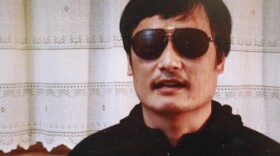 Blind lawyer Chen Guangcheng, seen in this image from a YouTube video, escaped last week after 19 months under house arrest. Searches for his name are banned on China's Twitter-like services.