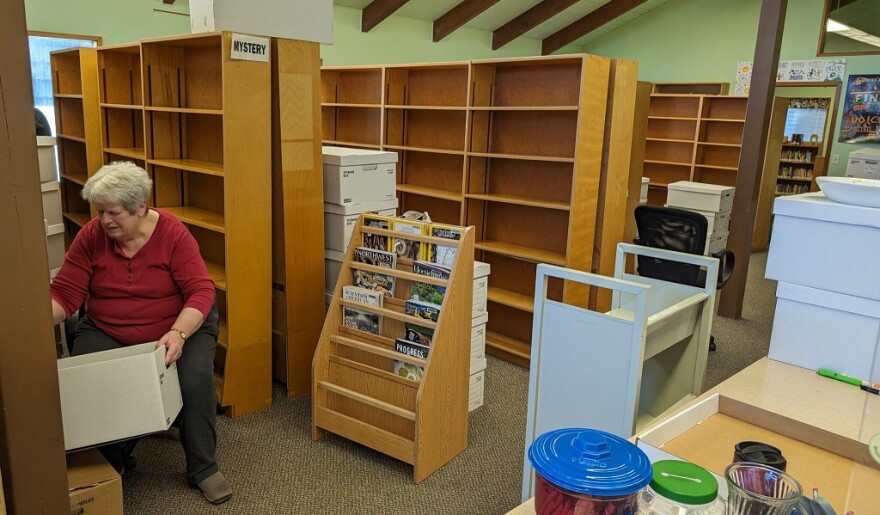 After more than seven hours of work Wednesday, most of the Yachats Library shelves behind volunteer Marion Godfrey were empty. Much of the library’s collection will be warehoused while work is underway for a new building on the current site.