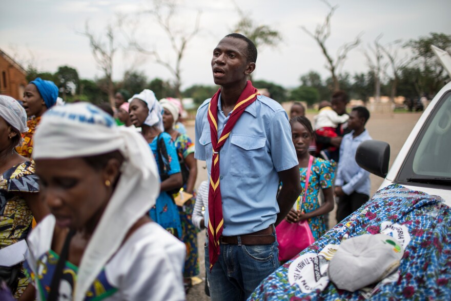 A scout, engaged to act as security, sings during an event at Notre Dame Cathedral in Bangui.