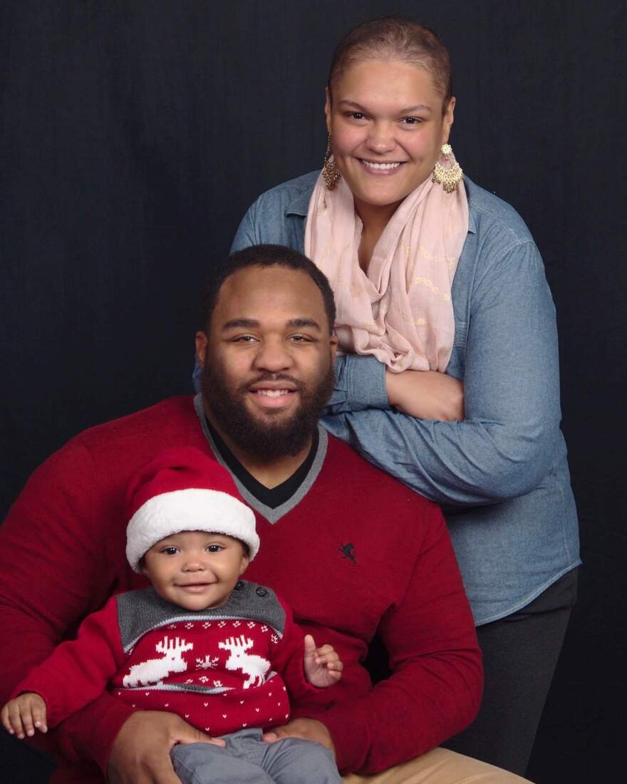 Samantha Blackwell poses with her husband, DeVon, and their son, DeVon. Blackwell's pregnancy went well, but just days after delivery, she was in a medically induced coma.