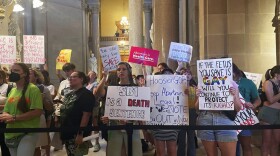 FILE - Abortion-rights protesters fill Indiana Statehouse corridors and cheer outside legislative chambers, Friday, Aug. 5, 2022, as lawmakers vote to concur on a near-total abortion ban, in Indianapolis. An Indiana judge on Thursday, Sept. 22, blocked the state’s abortion ban from being enforced, putting the law on hold as abortion clinic operators argue that the new law violates the state constitution.