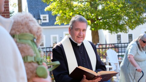 Father Gary Belliveau leads a brief blessing ceremony. "It's really about giving thanks for the gift of the animal."