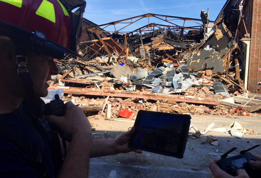 Firefighters surveyed the collapsed building in downtown Durham on Wednesday.