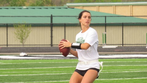 Badin's Hailey Weber drops back to pass during an afternoon practice.