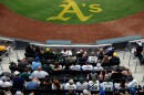 Fans gather to watch the Milwaukee Brewers face off against the Athletics during the first inning of a baseball game Monday, June 8, 2026, in Las Vegas. (AP Photo/Caroline Brehman)