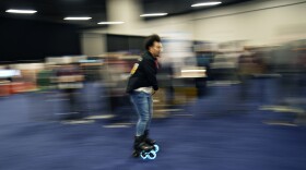 Mohamed Soliman of Atmos Gear shows off the Atmos Gear inline electric skates during CES Unveiled before the start of the CES tech show, Tuesday, Jan. 3, 2023, in Las Vegas. (AP Photo/John Locher)