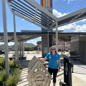 Erin Reed, executive director of the Dickinson County Trails Board, at the Tatanka Ska Trace Trailhead in Spirit Lake, Iowa. (Bret Hayworth, Siouxland Public Media News)