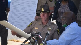 Capt. Chad Peterson, commander of Illinois State Police District 8, left, and Pastor Marvin Hightower, president of the Peoria NAACP branch, read aloud the 10 Shared Principles on Wednesday, Sept. 30, 2020.