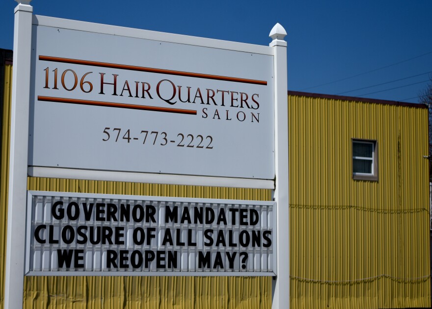 A hair salon in Nappanee displays a closure sign in April 2020 related to Gov. Eric Holcomb's COVID-19 executive orders.