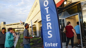Voters enter the Hamilton County Board of Elections on the first day of early voting, Wednesday, Oct. 10, 2018, in Cincinnati. 