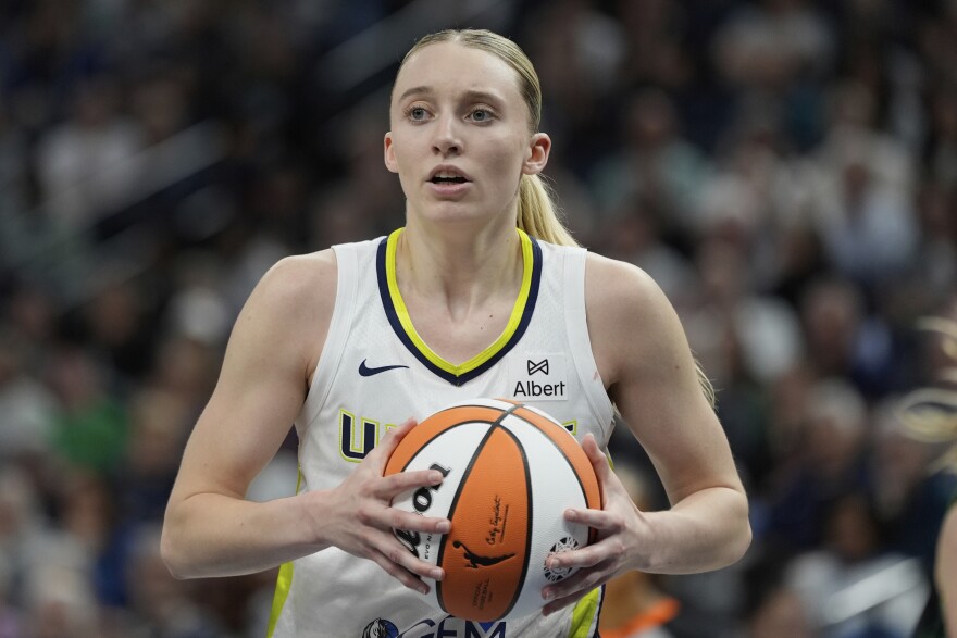 Dallas Wings guard Paige Bueckers (5) looks toward a referee after being called for a foul during the second half of a WNBA basketball game against the Minnesota Lynx, Wednesday, May 21, 2025, in Minneapolis.