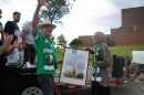 Lawrence, Kansas, artist Stan Herd, at left, accepts a signed, framed photograph from the Algerian community as a thanks for his flag art on June 13.