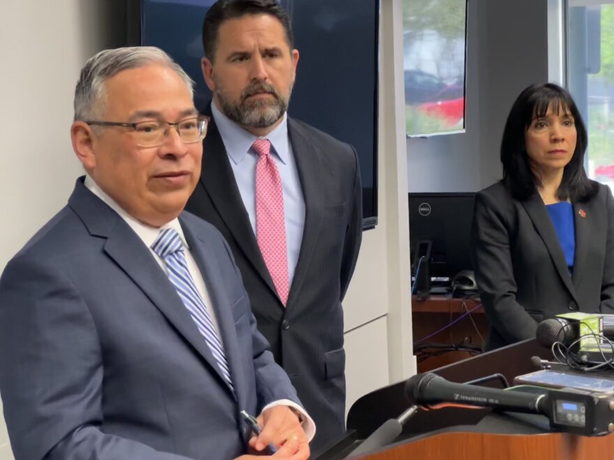 San Antonio City Attorney Andy Segovia (left) speaks about the settlement regarding a 2017 human smuggling incident. City Manager Erik Walsh stands center, and Deputy City Manager María Villagómez is to the right.