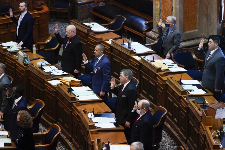 Members in the Iowa House take the oath of office during the opening day of the Iowa Legislature, Monday, Jan. 11, 2021, at the Statehouse in Des Moines, Iowa.