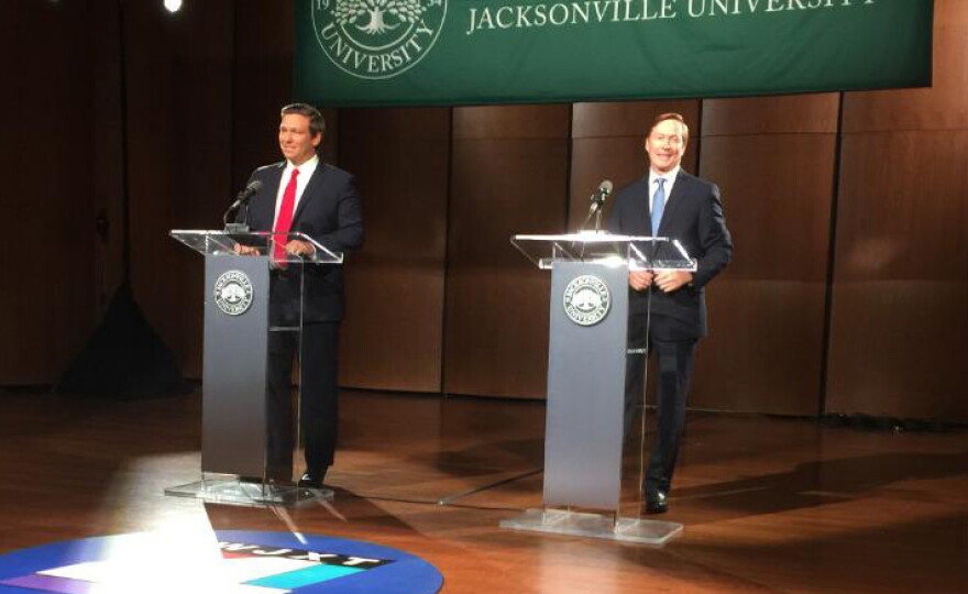 Ron DeSantis (left) and Adam Putnam shared the stage at Jacksonville University Thursday night for a debate.