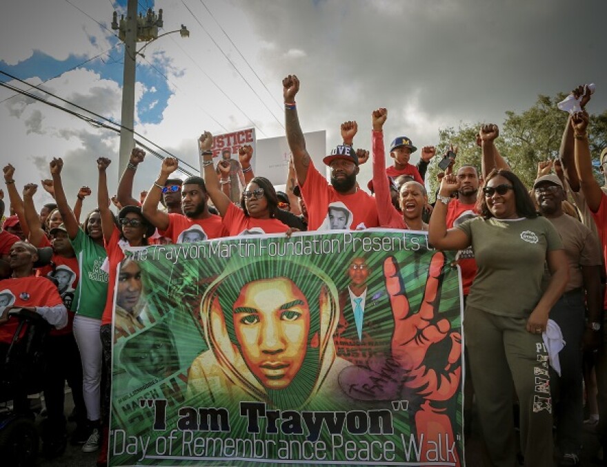 Sybrina Fulton (center), Tracy Martin and many more take part in Trayvon Martin's Peace Walk in Miami Gardens, FL on February 10, 2018.