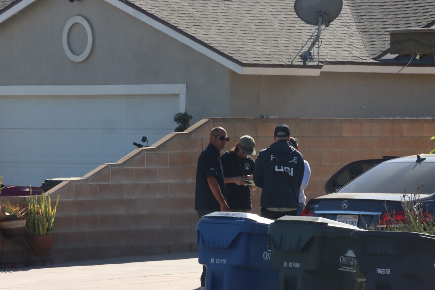 Agents with Homeland Security Investigations (HSI) conduct their investigation near the site where Carlos Jimenez was shot by federal immigration agents in Ontario on October 30, 2025.