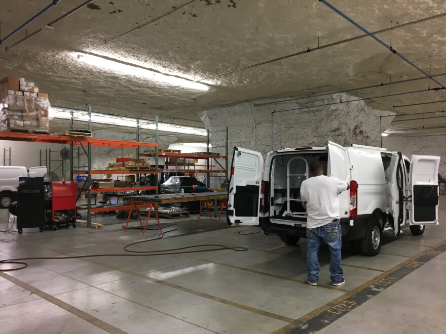 A worker "upfits" a new Ford Transit van on the assembly line at Knapheide, a company located below ground in the SubTropolis. 