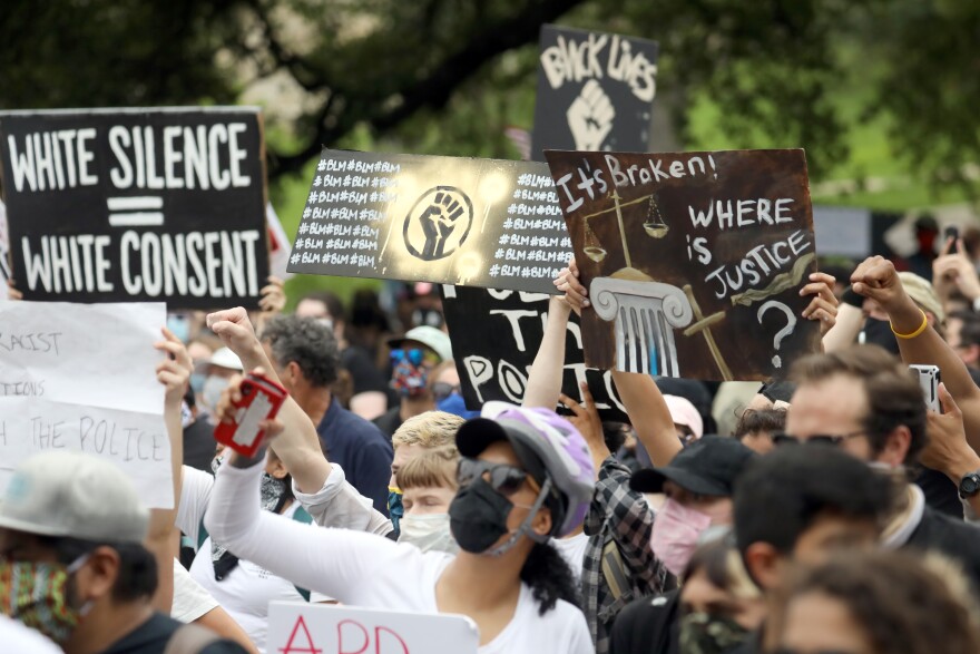 Protesters gather in downtown Austin on Sunday demanding justice for black people killed by police. 