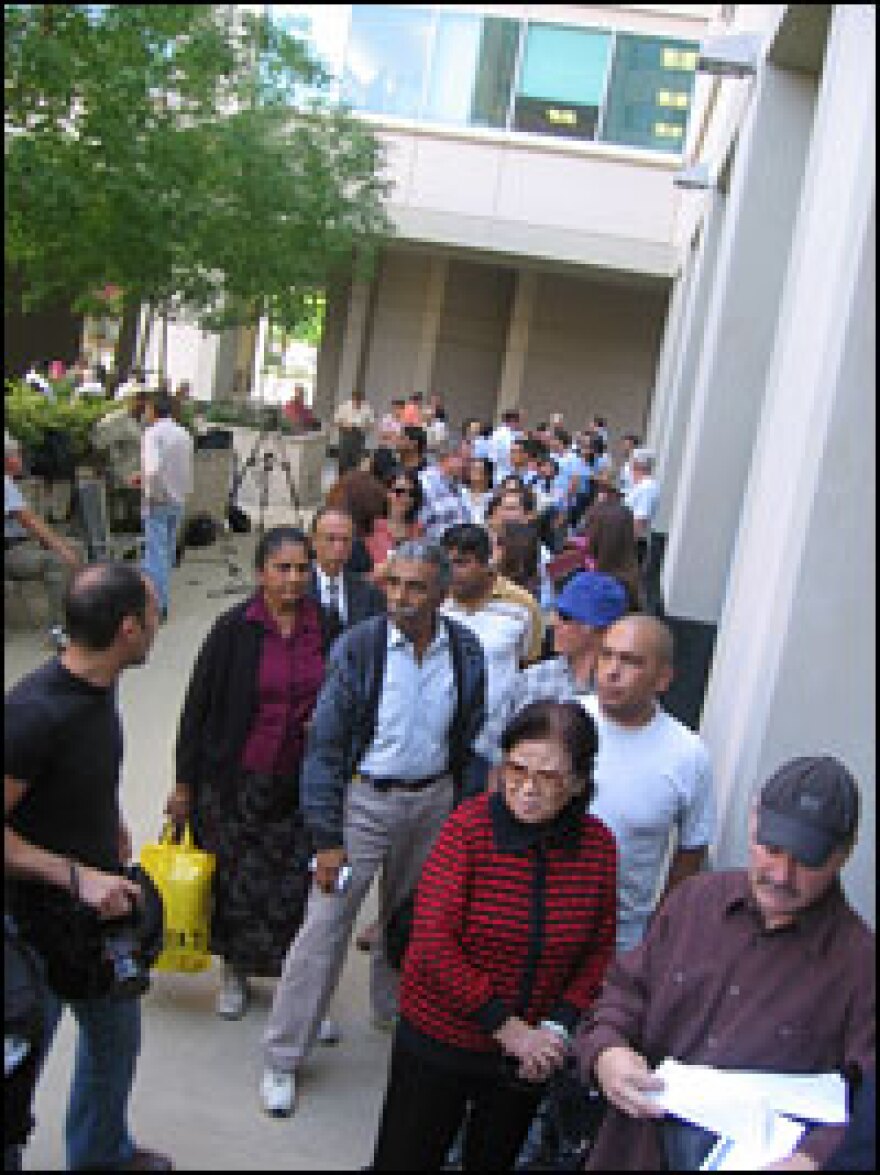 Customers line up outside IndyMac bank in Pasadena, Calif., to withdraw their funds. The Federal Insurance Deposit Corporation took over the bank on Friday.