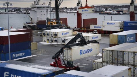 Shipping containers are unloaded at the International Marine Terminal, Wednesday, Jan. 25, 2023, in Portland, Maine.