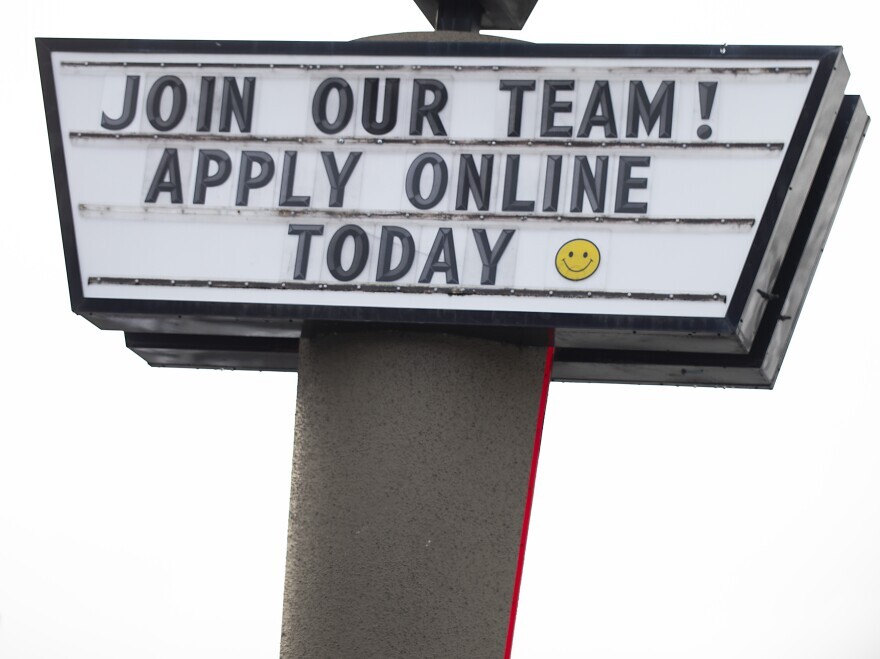 A sign saying, "JOIN OUR TEAM! APPLY ONLINE TODAY" 