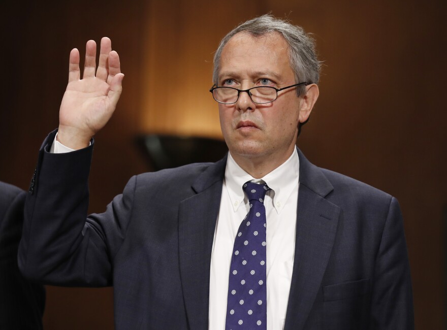 Thomas Farr, with right hand raised, is sworn in during a Senate Judiciary Committee.