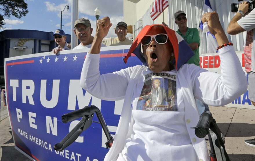 Cuban-American Ana Acosta Ayon chants pro Trump slogans, Friday, Jan. 20, 2017, in the Little Havana area in Miami, before President-elect Donald Trump is sworn in as the 45th president of the United States. (AP Photo/Alan Diaz)