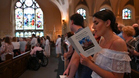 The congregation sings at Nativity of Our Lord Church in South Scranton to open the church's final Mass recently.