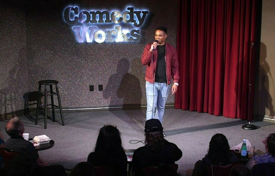 <em>Jimmy Kimmel Live!</em> writer Troy Walker, on stage at Comedy Works in Denver.