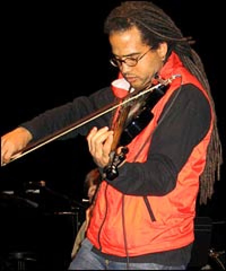 Roumain dubs his musical style "dred violin."