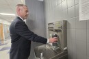 Lakeland School District Marc Wyandt fills his water bottle in the high school. A filter in the fountain removes PFAS chemicals from the drinking water.