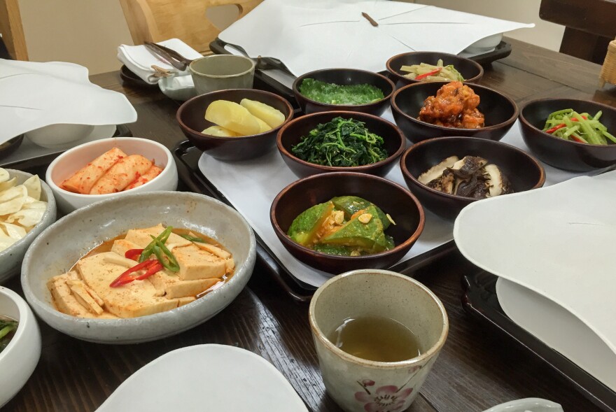 "The food creates the entire human being," says Gye Ho, the nun who runs the table. (Above) An array of dishes served at the temple, including root chips, pickled radishes, marinated tofu, potatoes, stir-fried greens, squash, green tea, mushroom fritters and caps. The dishes feature no meat, fish or MSG.