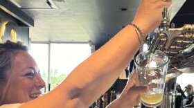 Alyson Vann serving Alamo Beer to thirsty customers at Alamo Beer Company