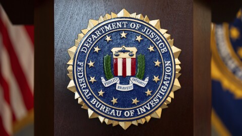 FILE - An FBI seal is displayed on a podium before a news conference at the field office in Portland, Ore., on Jan. 16, 2025.